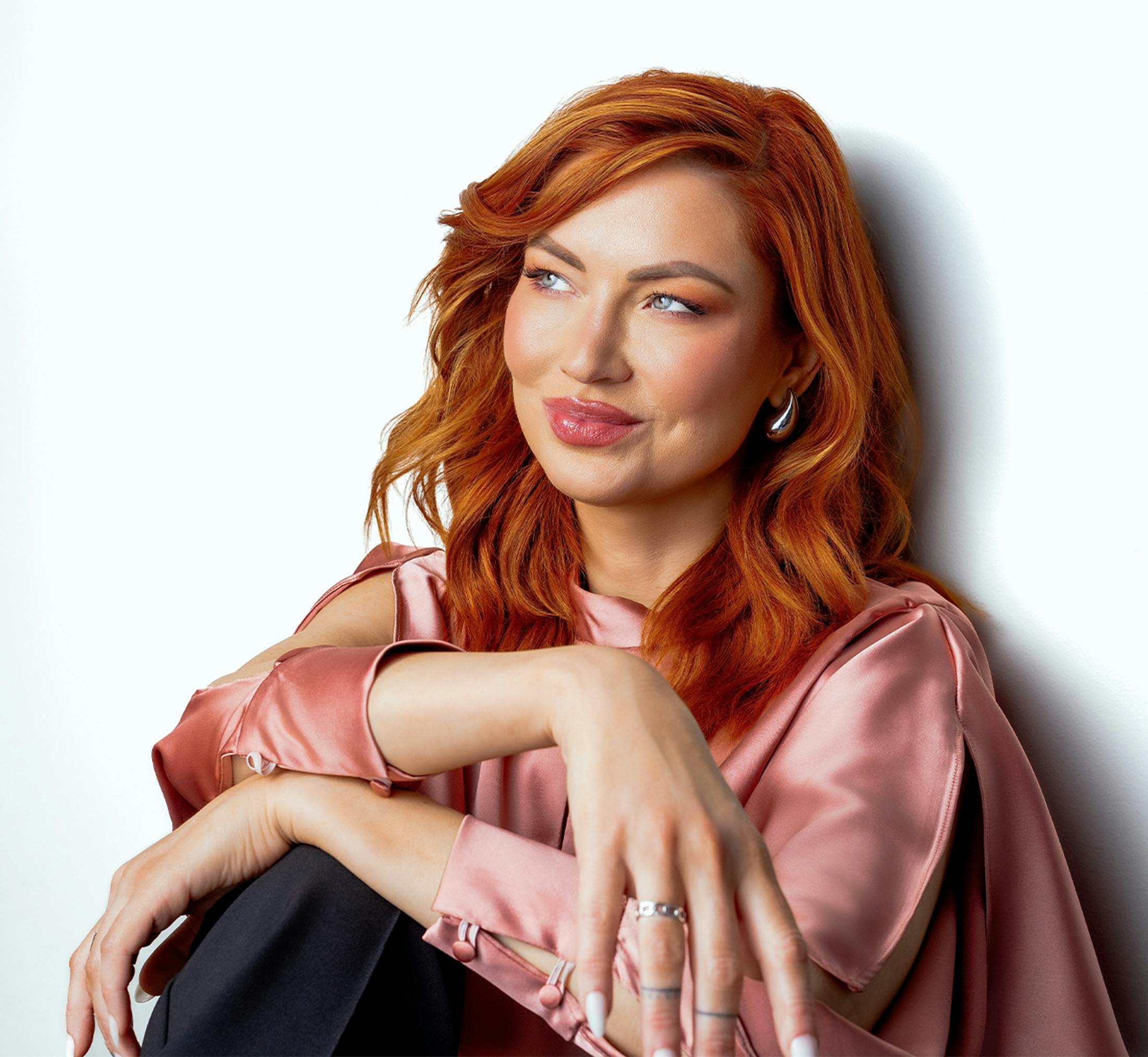 woman with arms crossed sitting