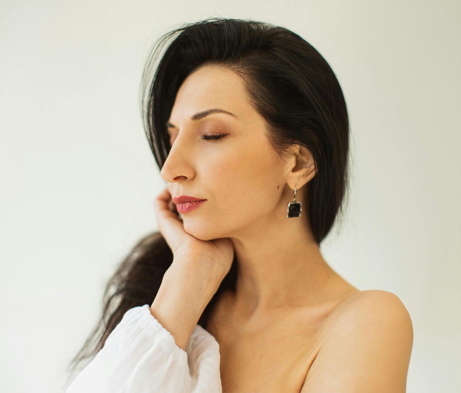 woman with hand in face