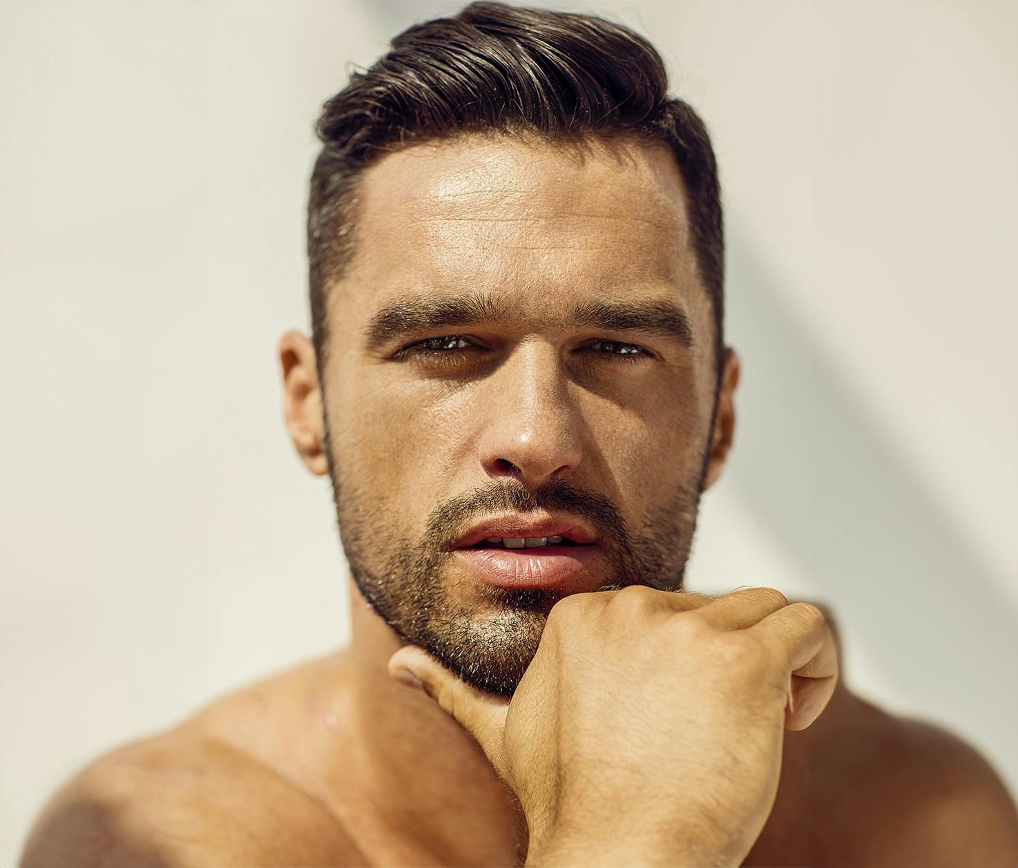 man with chin in hand