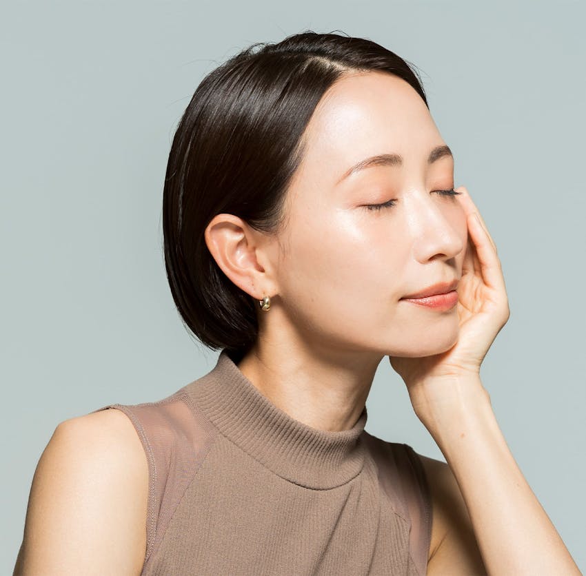 Woman with eyes closed