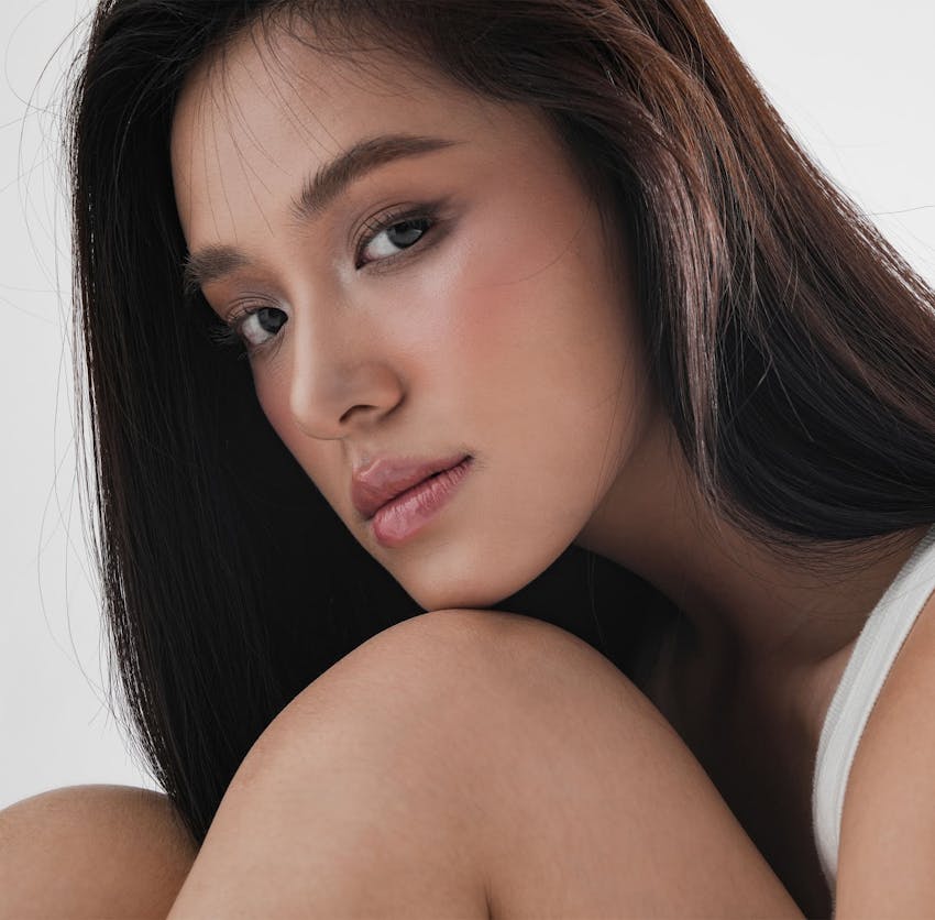 Woman with chin on knee