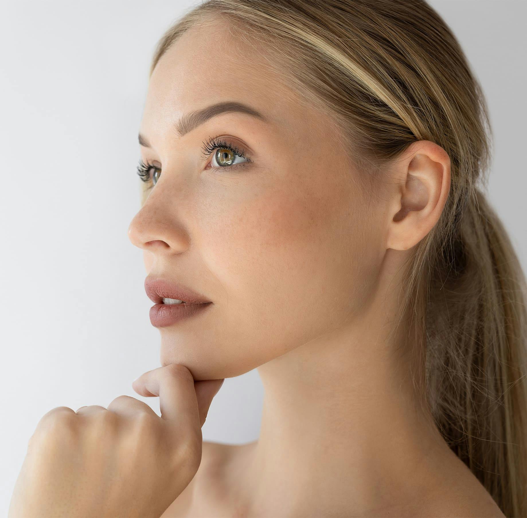 Woman touching her chin