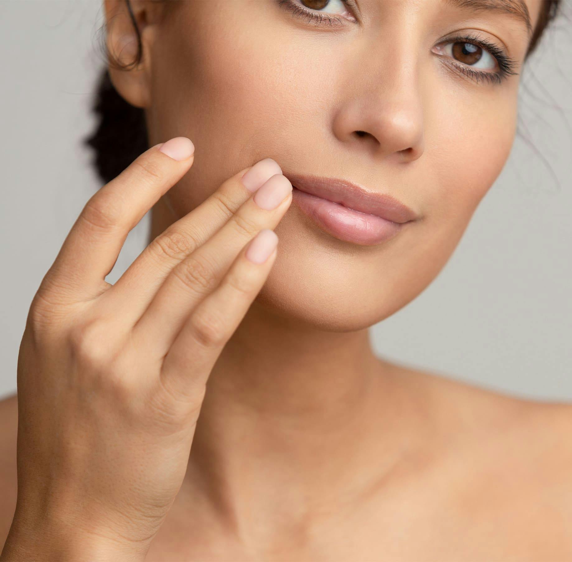 Woman touching mouth