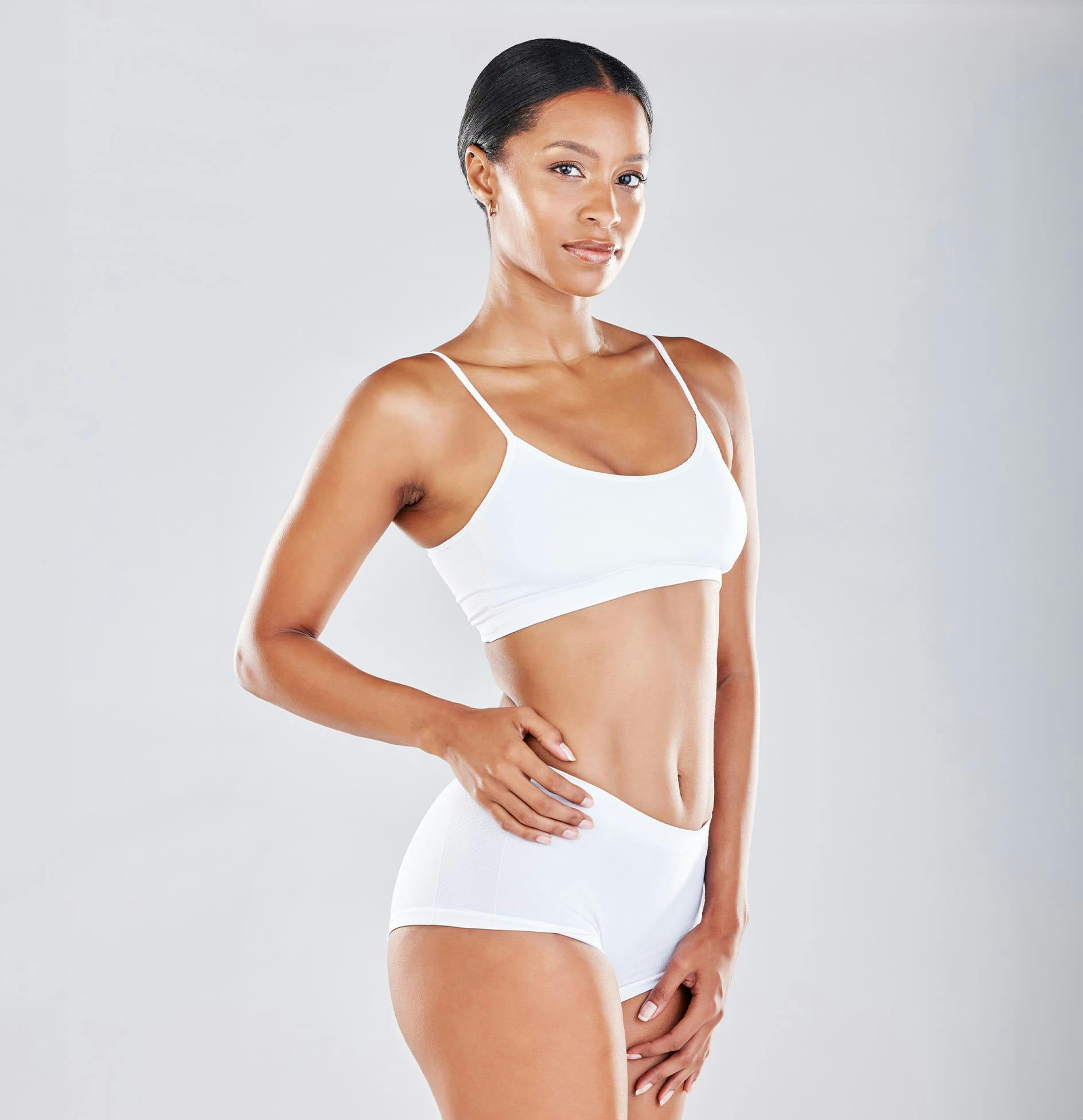 Woman standing with hand on hip