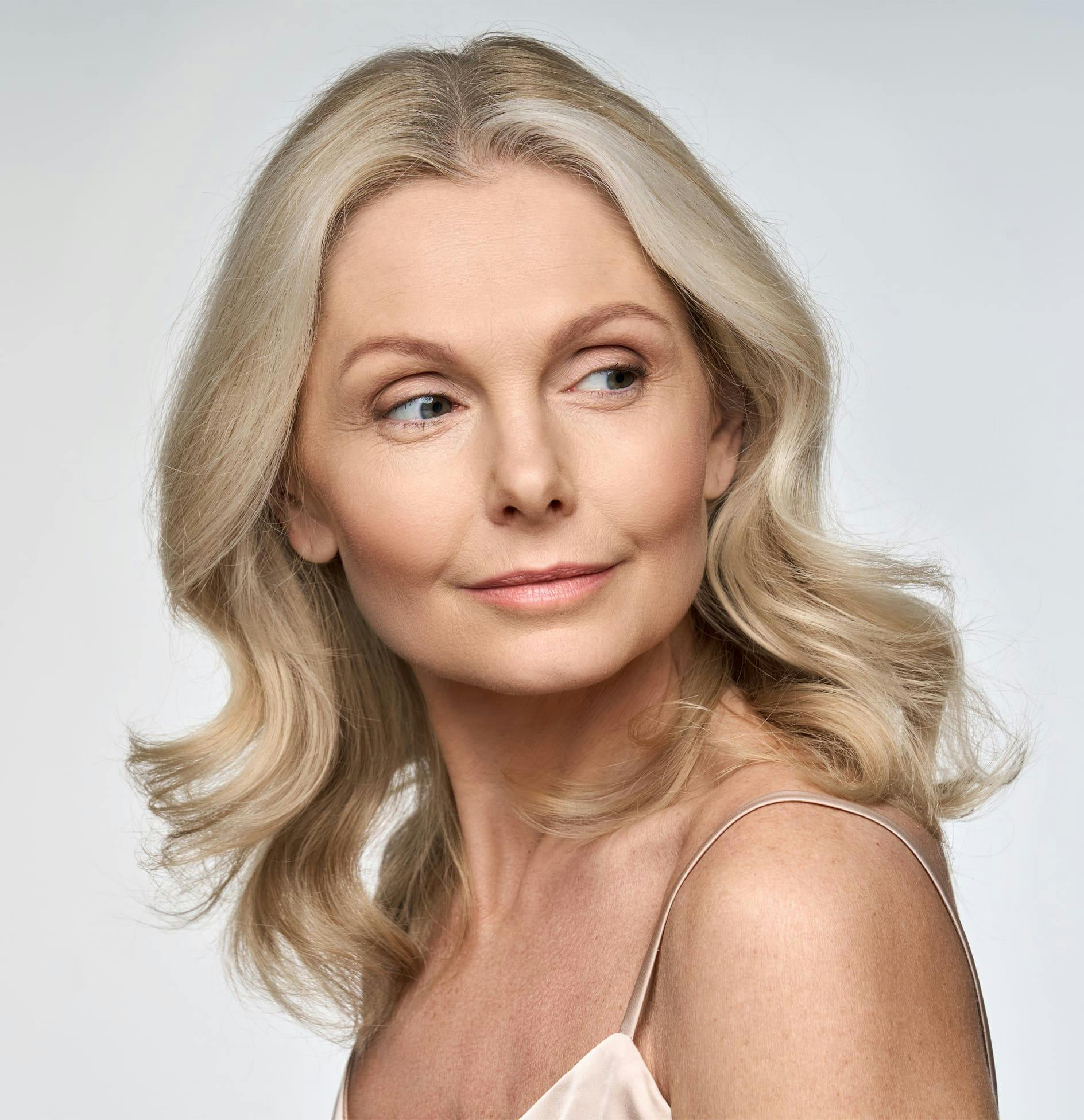 Woman smiling and looking over shoulder