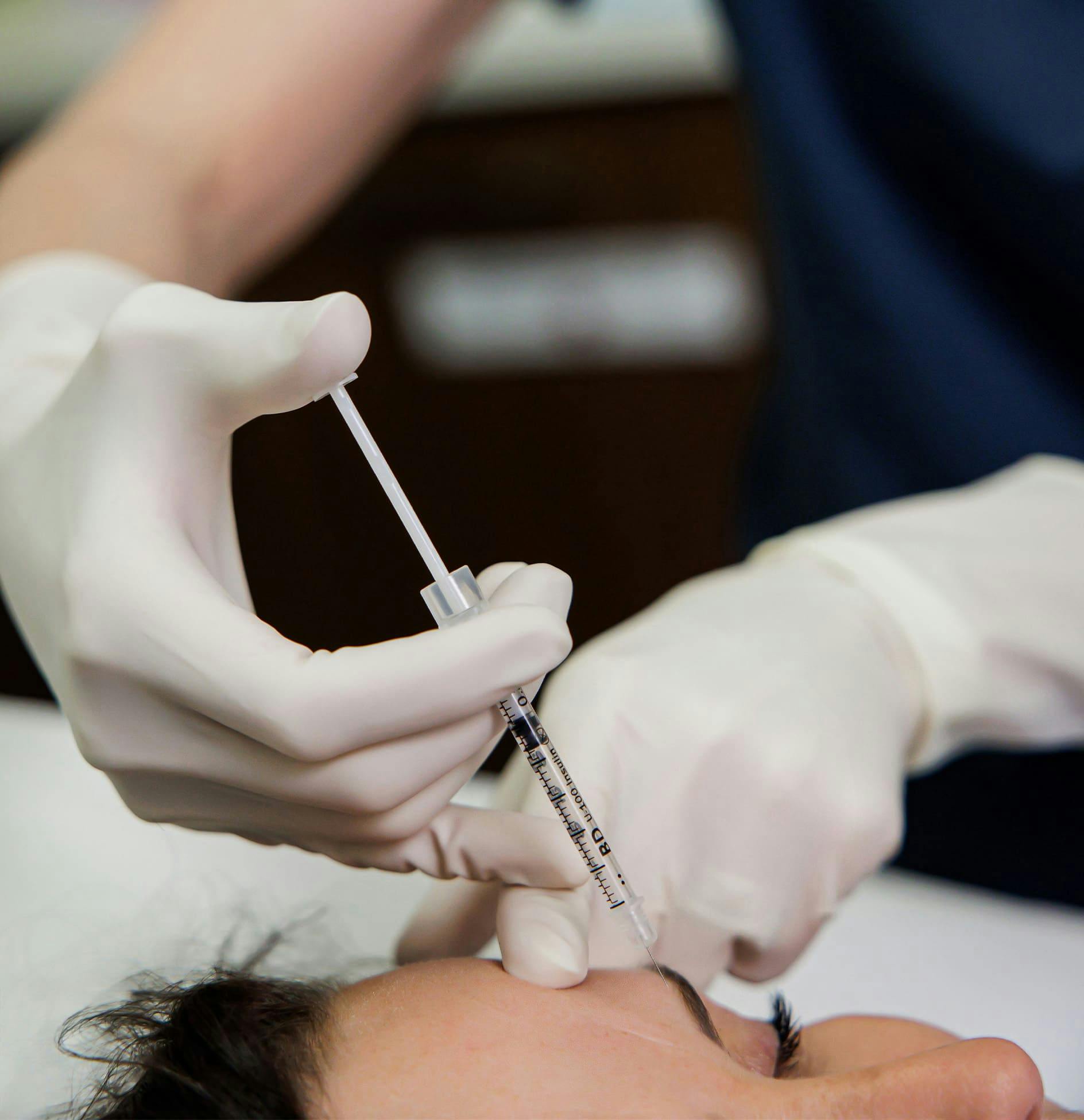 Doctor holding injectable