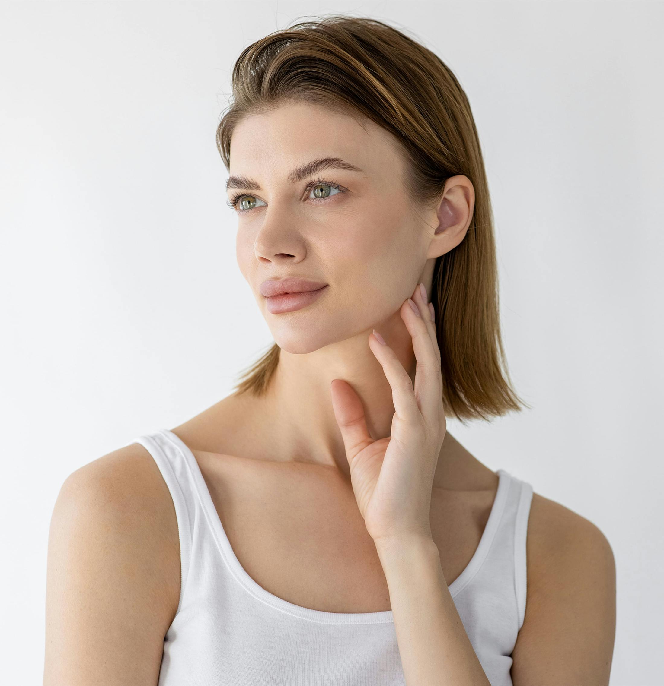 Woman touching jawline