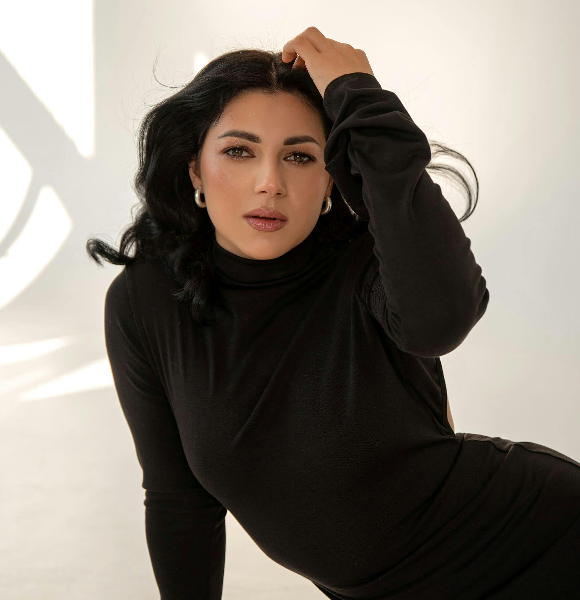 Woman with hand in hair