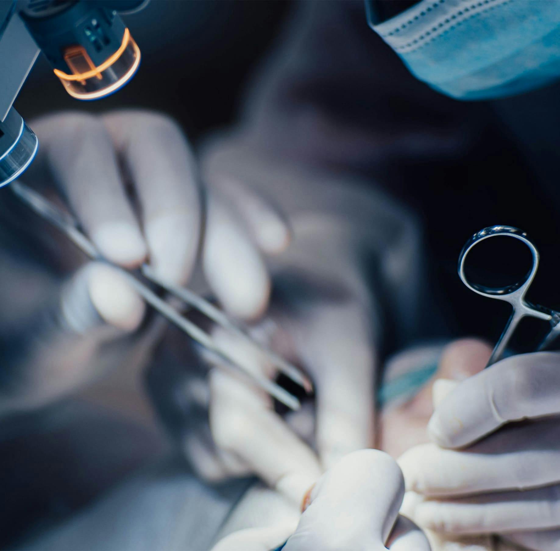 Doctors using surgical tools