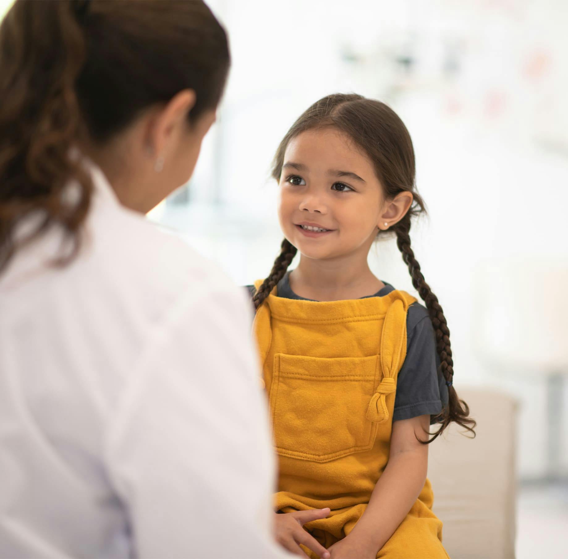 Doctor and child speaking