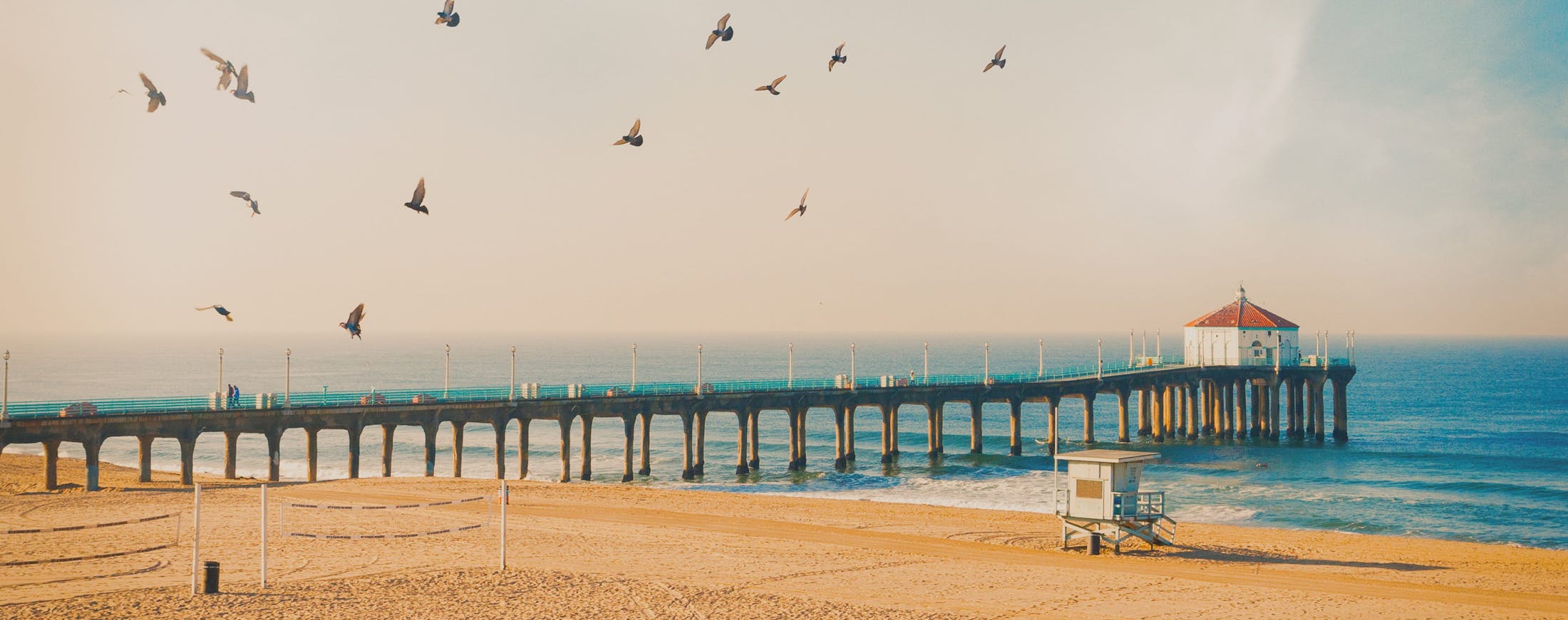 Bridge going out to a pier on beach