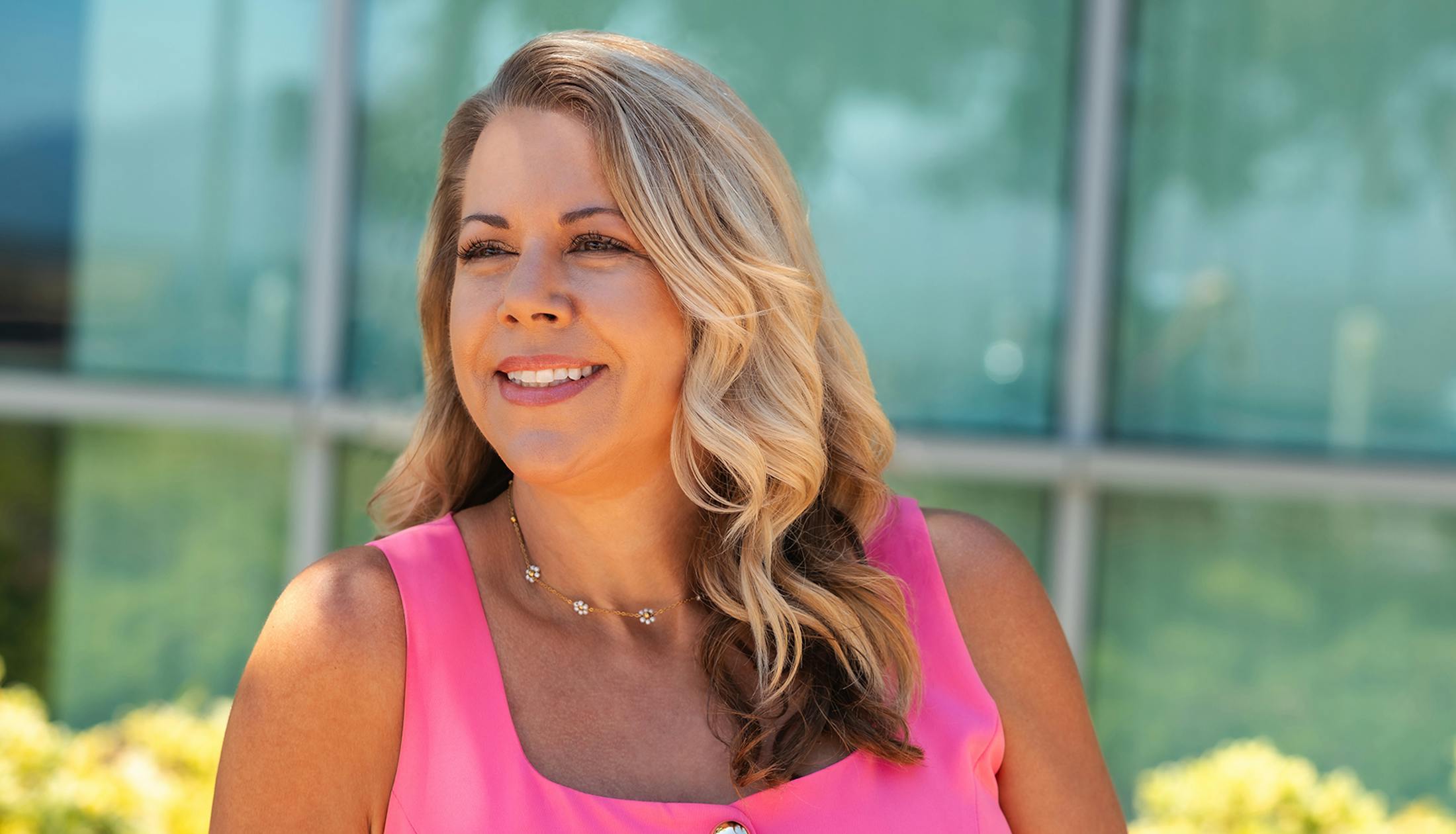 woman smiling in pink tanktop