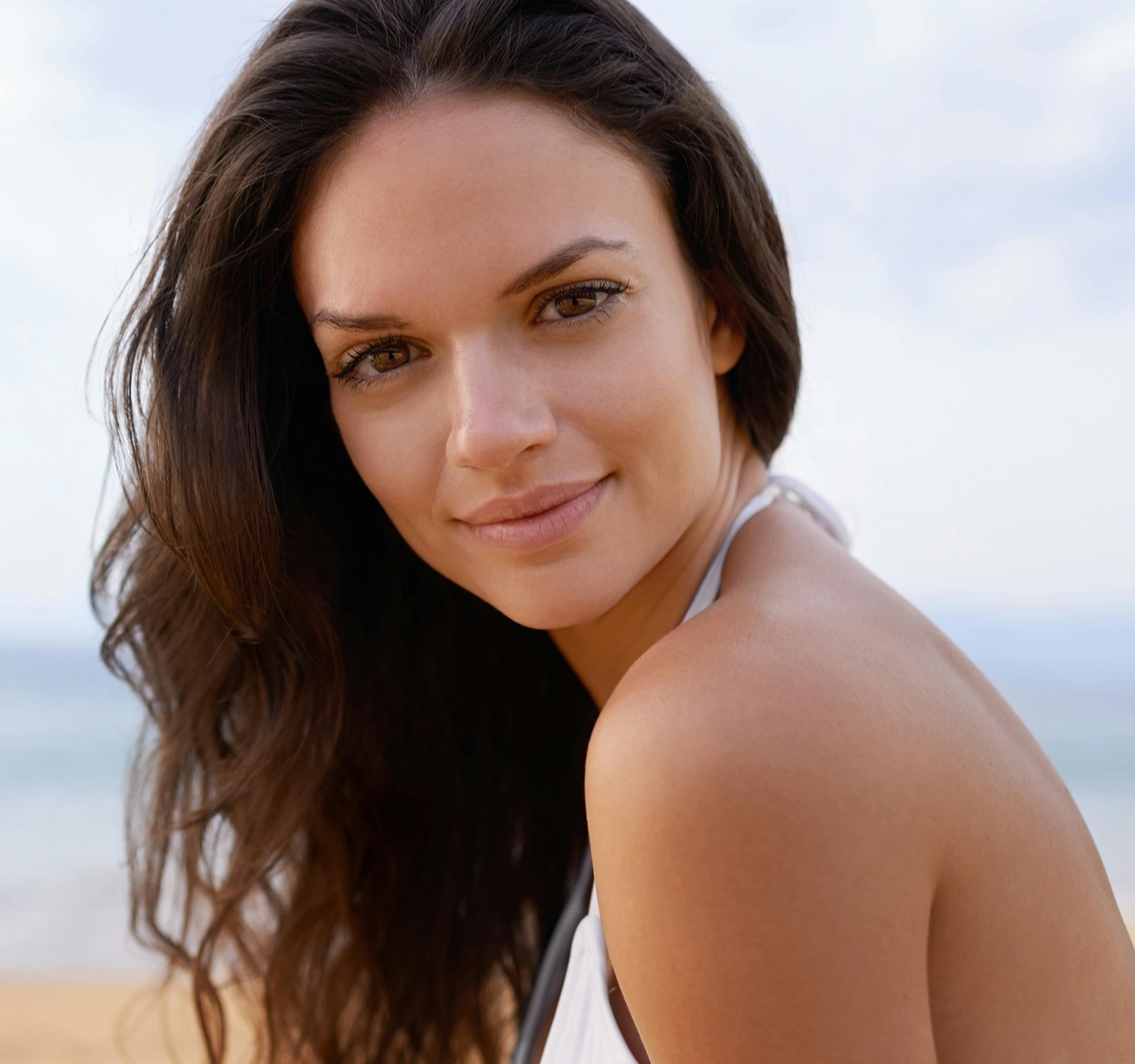 woman looking forward with her hand flowing in the wind