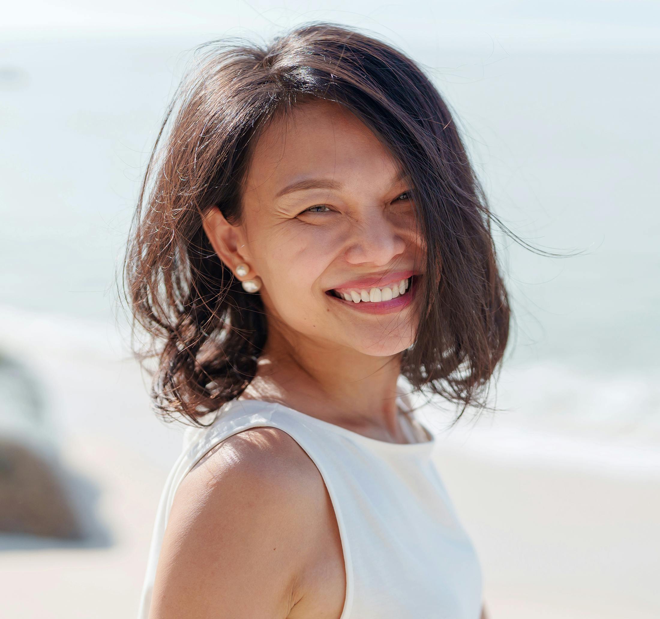 woman with short hair smiling
