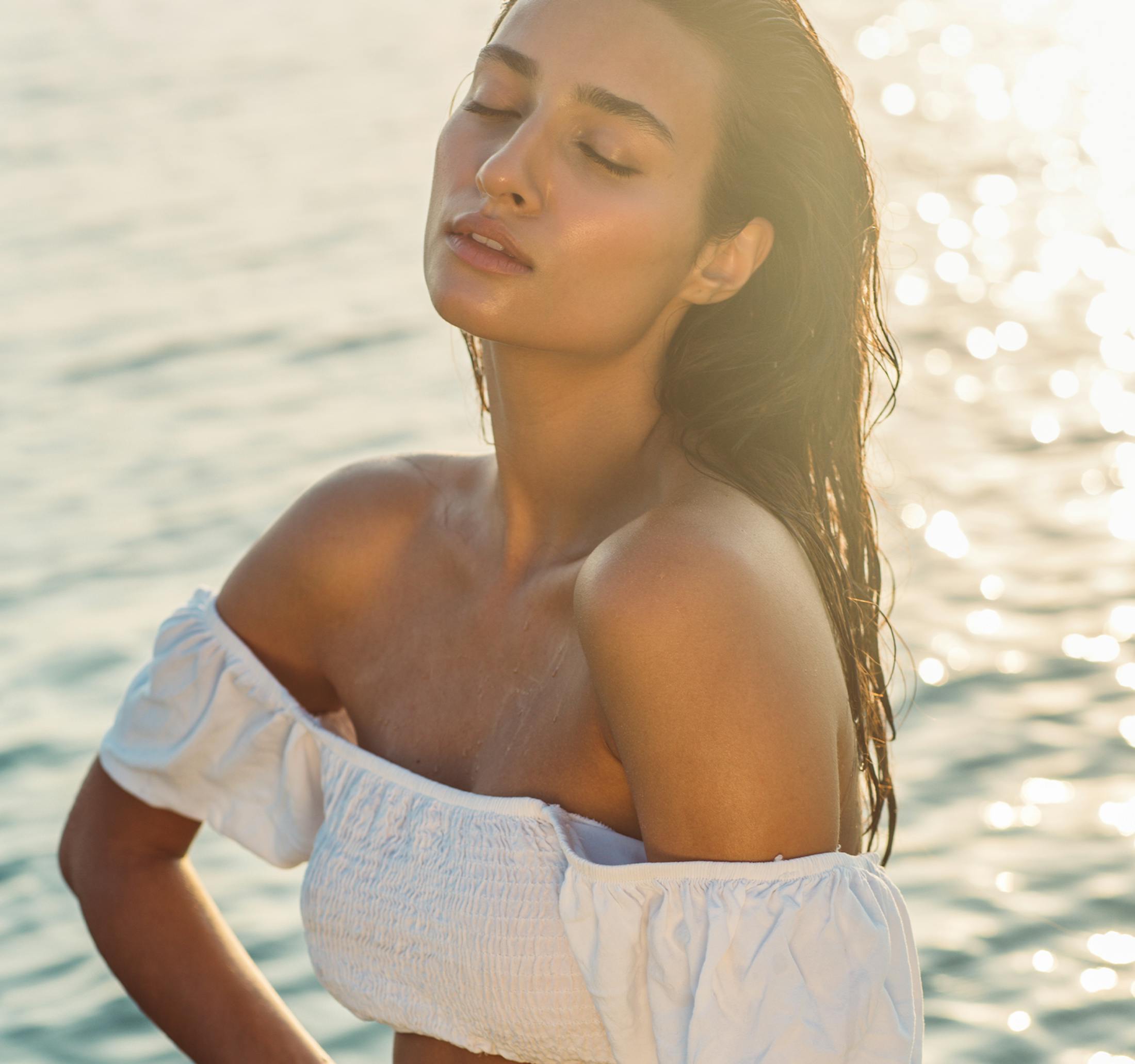 woman with wet hair in the water