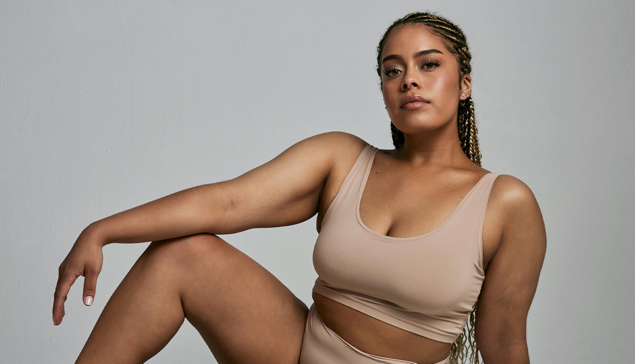 woman sitting with arm resting on her knee