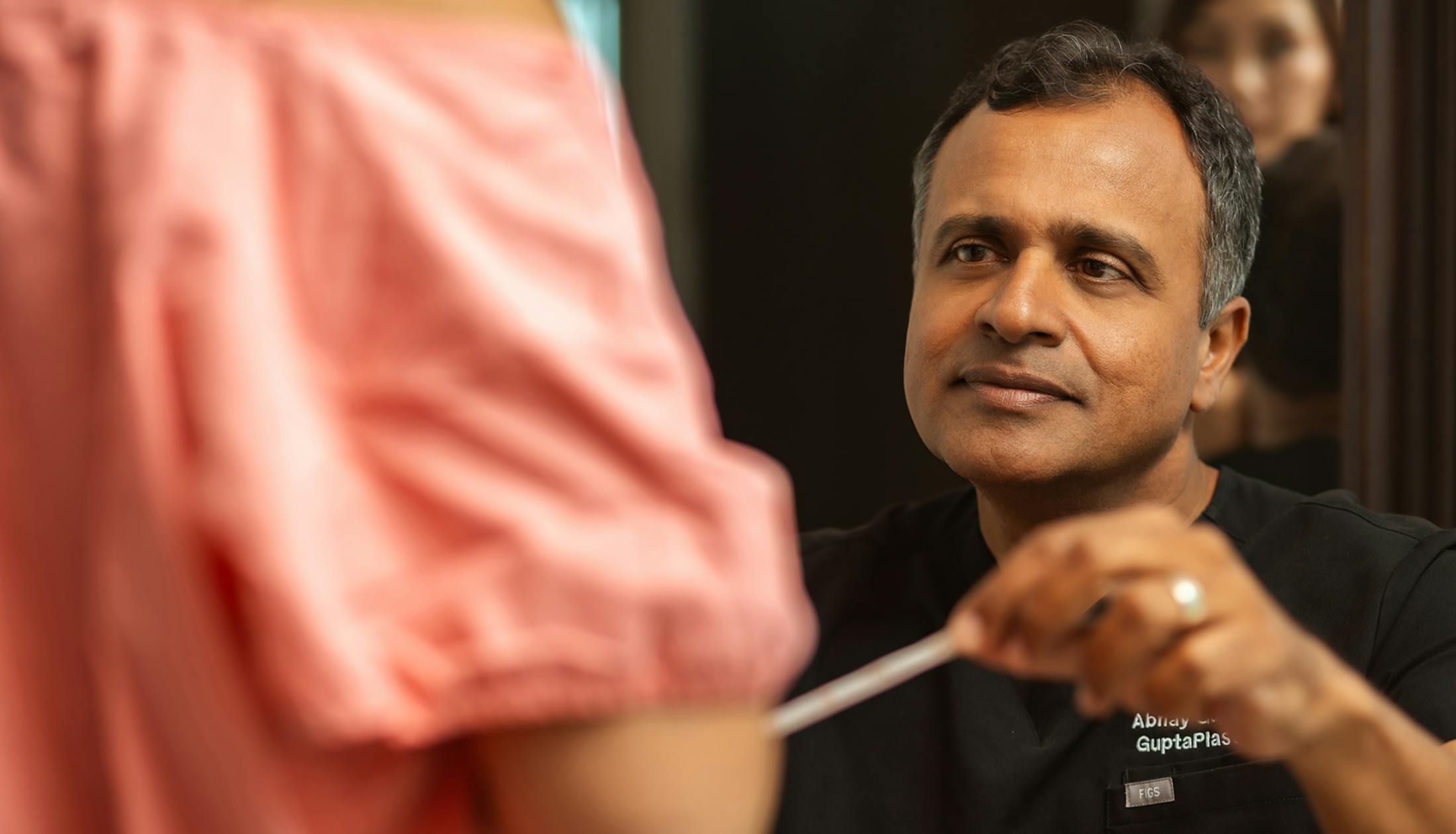 dr. gupta measuring a patient