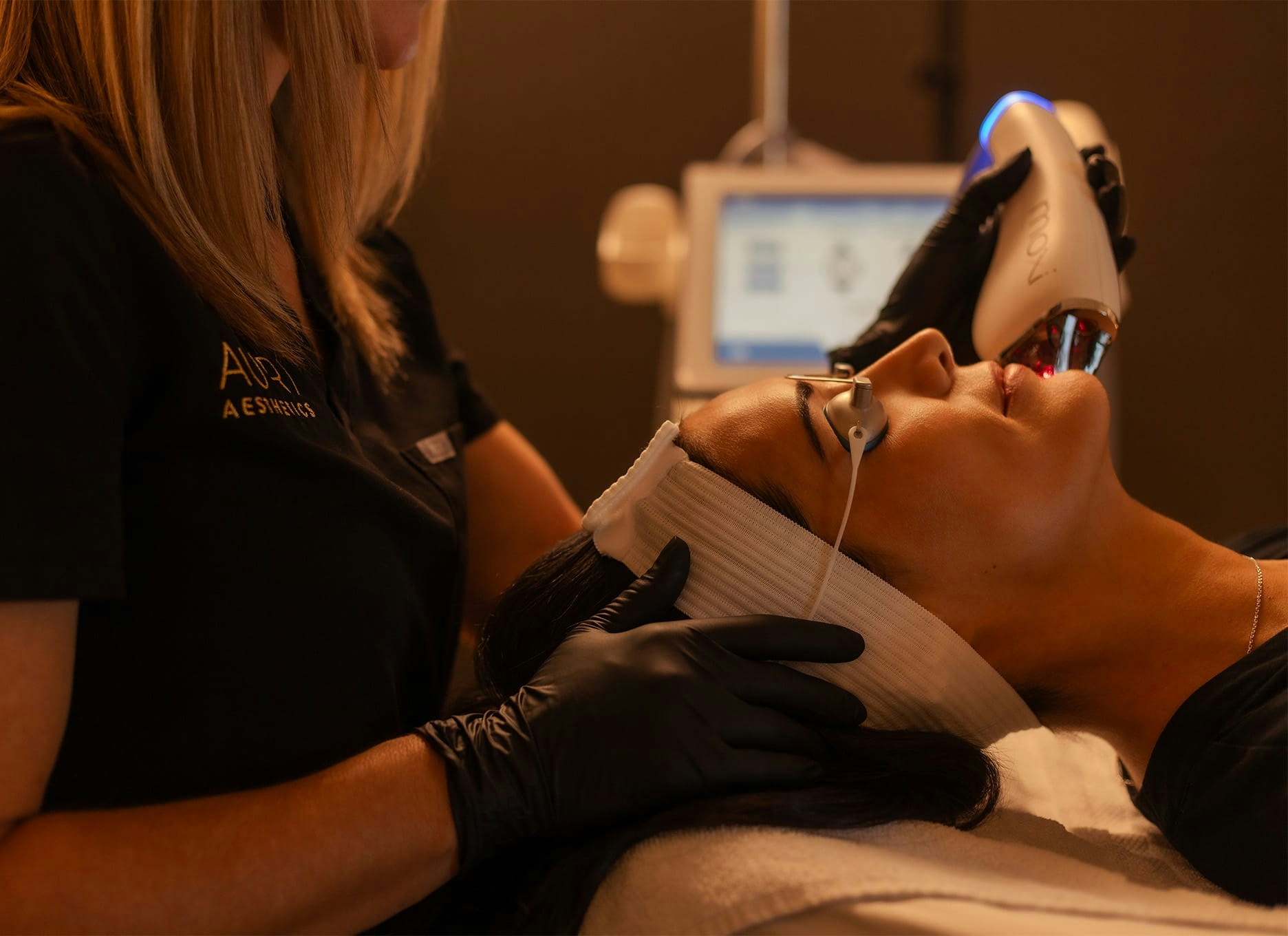 woman getting a moxi laser treatment