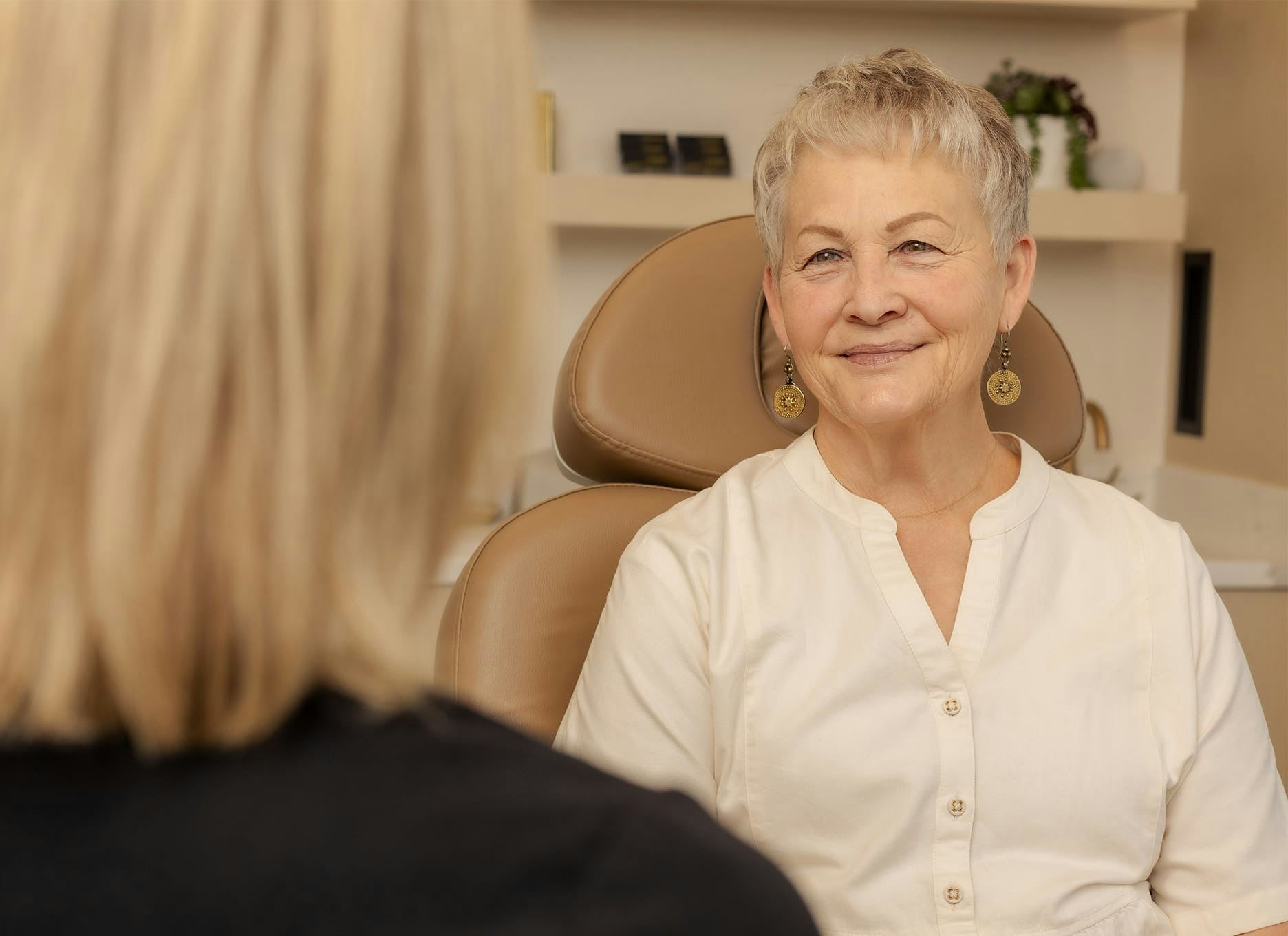 older woman smiling at the doctor