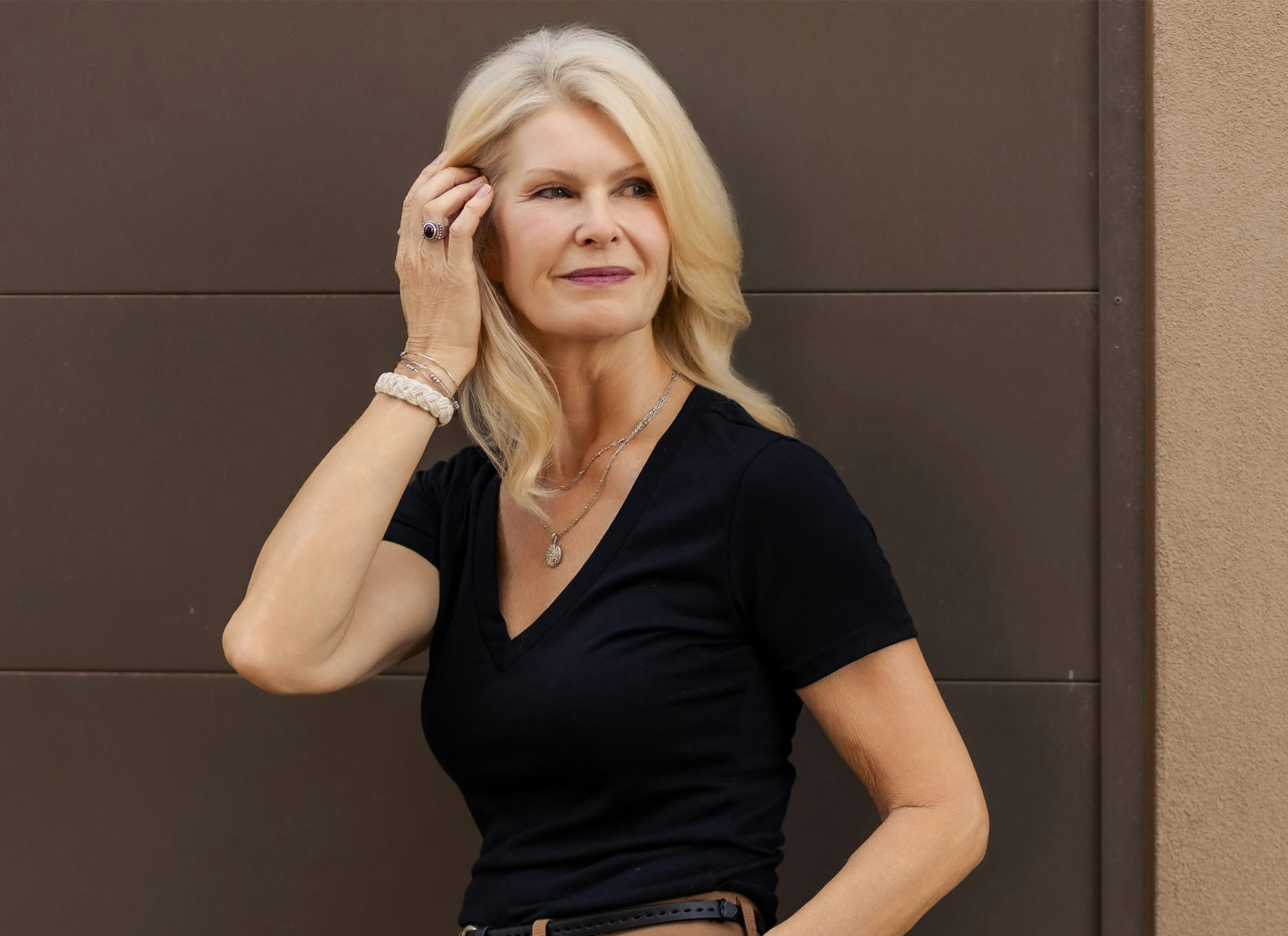 woman tucking her hair behind her ear