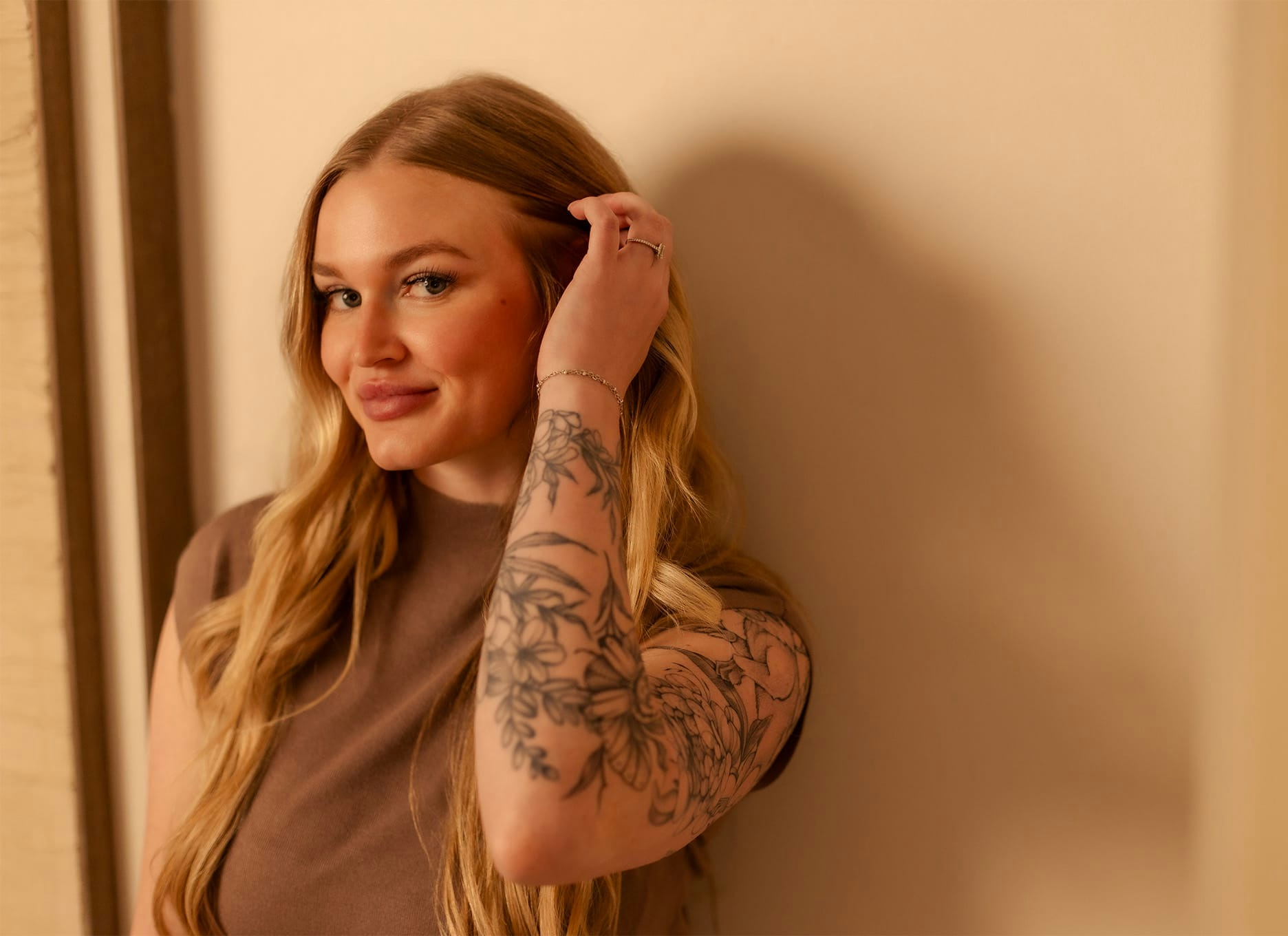 woman pushing their hair behind her ear