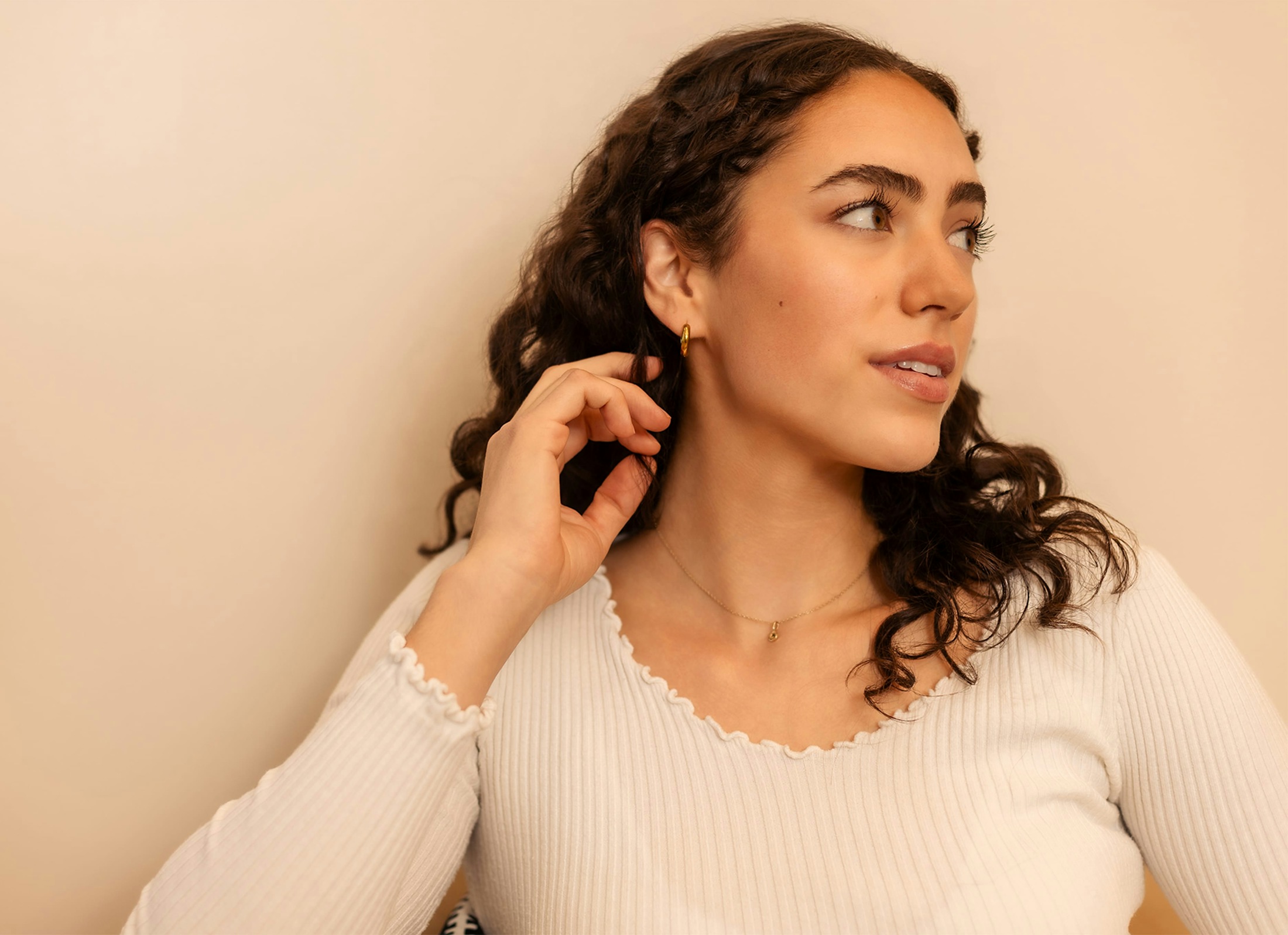 woman touching her neck