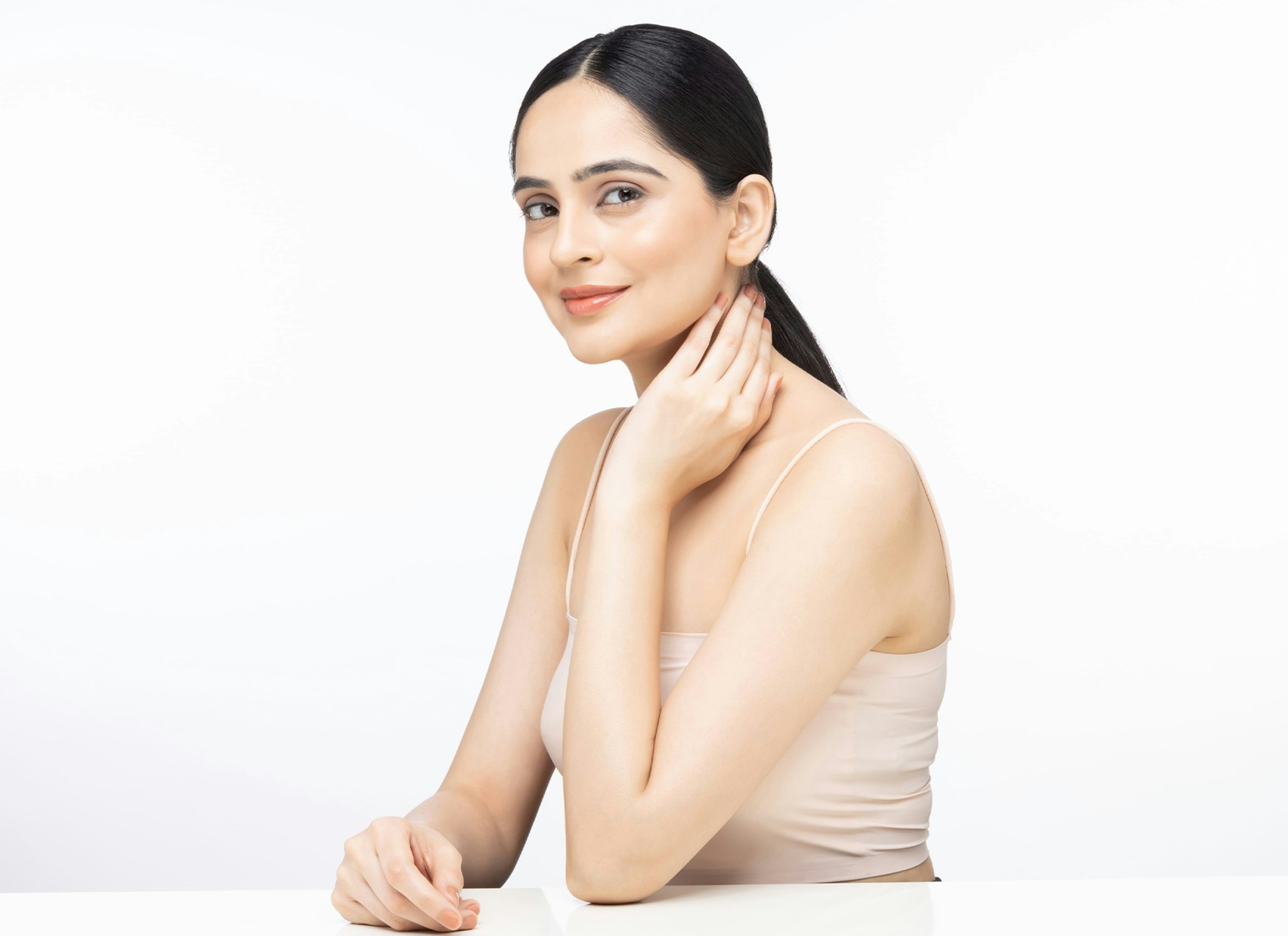 woman touching her neck