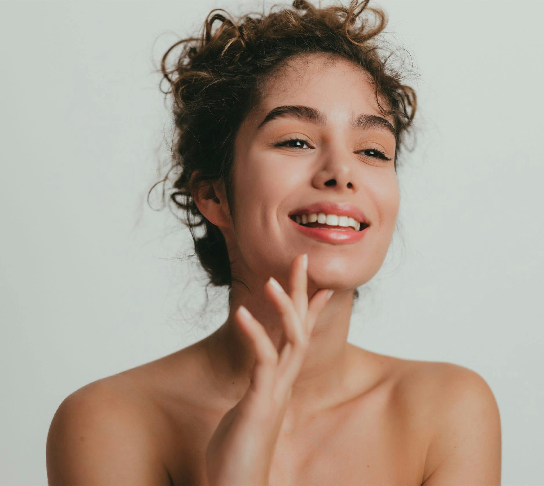 woman touching her chin