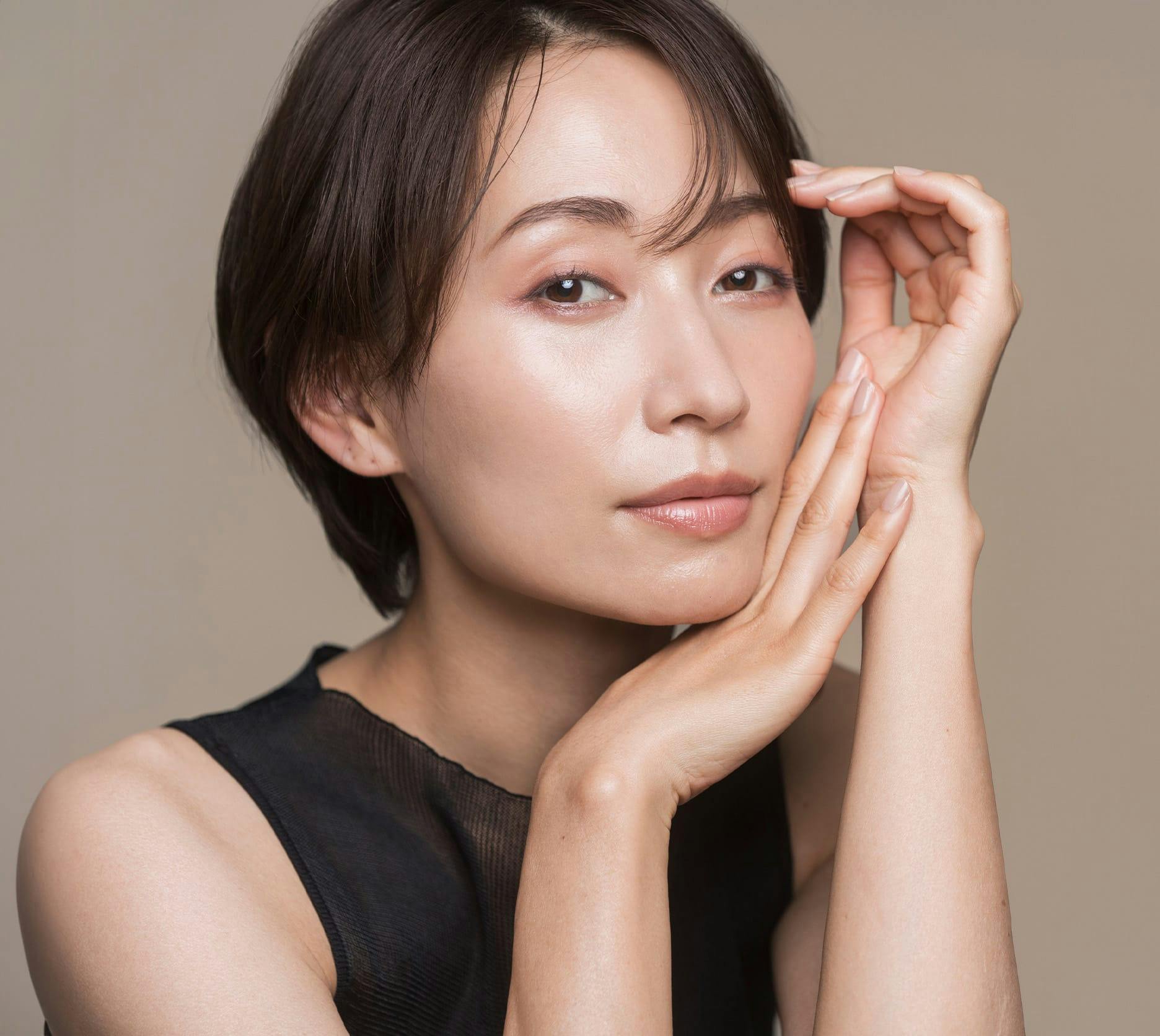 woman touching her face