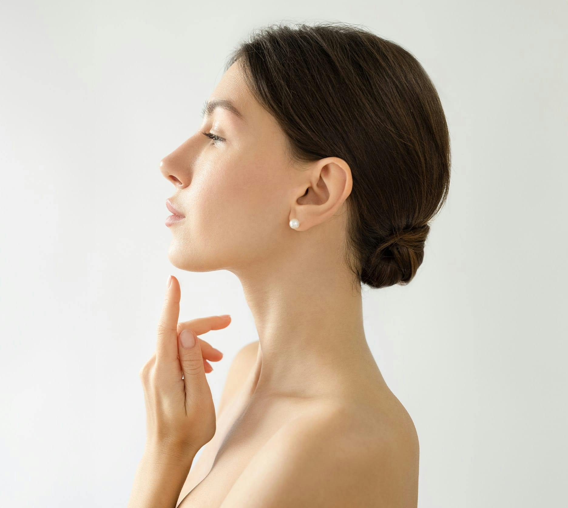 woman about to touch her chin