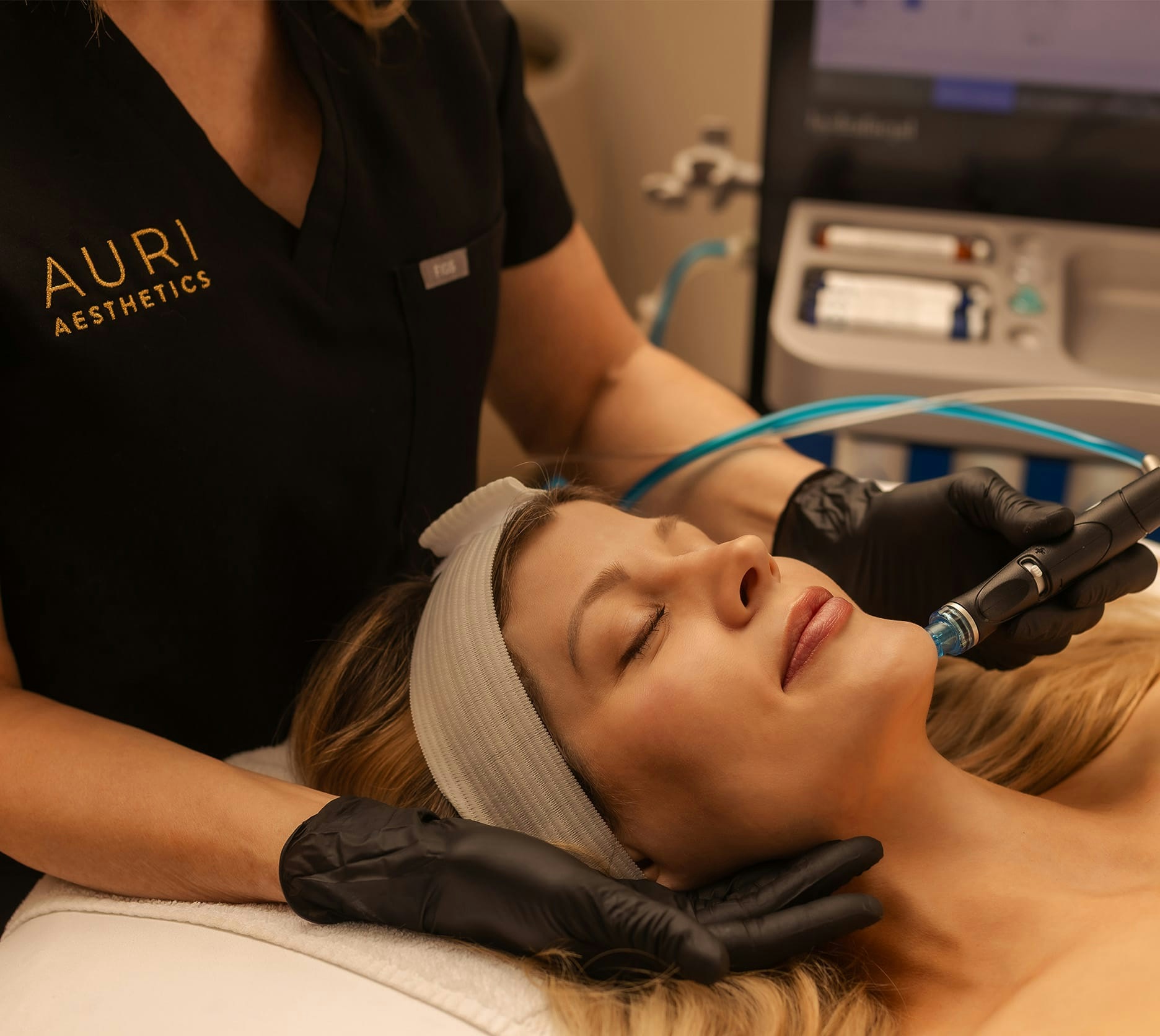 Woman getting HydraFacial treatment