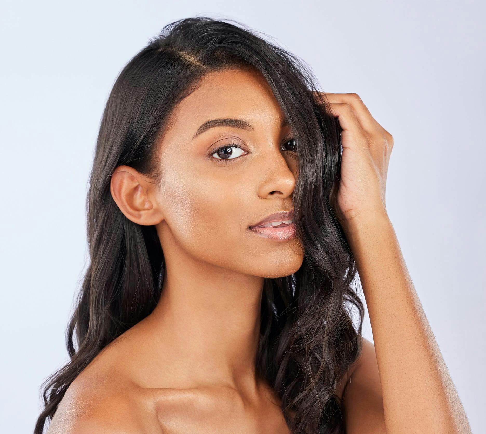 woman touching her hair