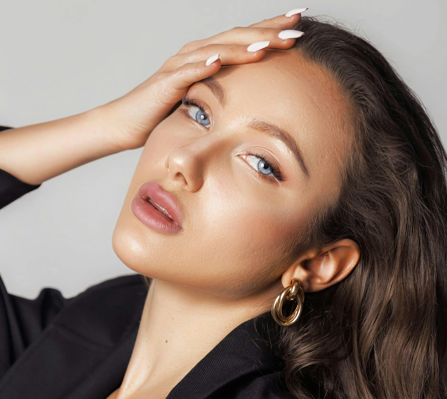 woman touching her head