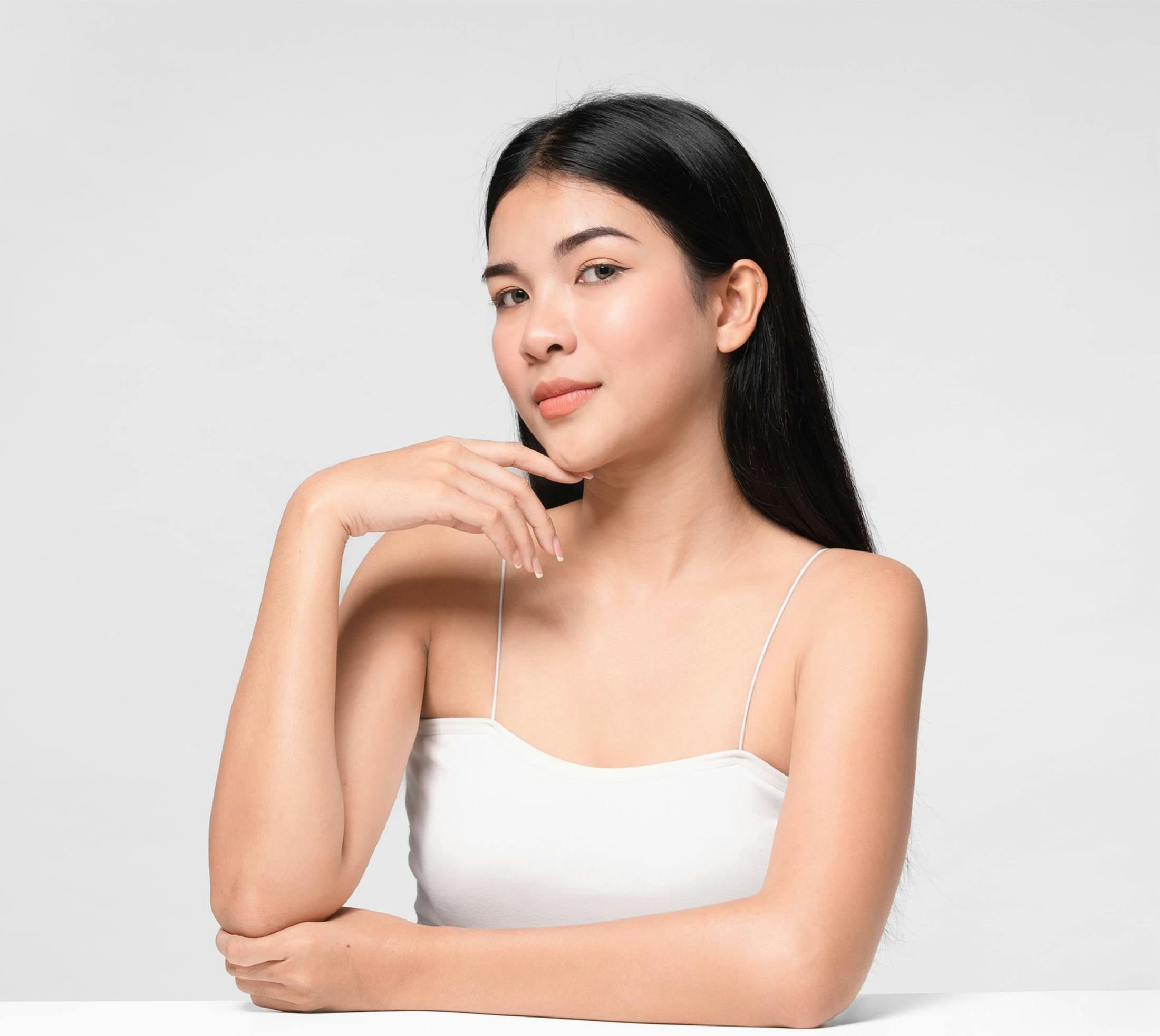 woman touching her chin