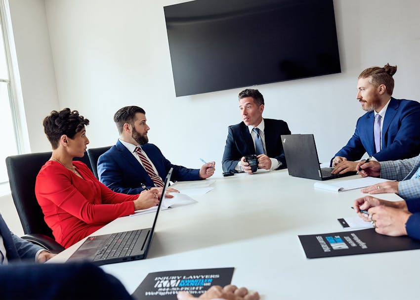 Lawyers of Kwartler Manus sitting together