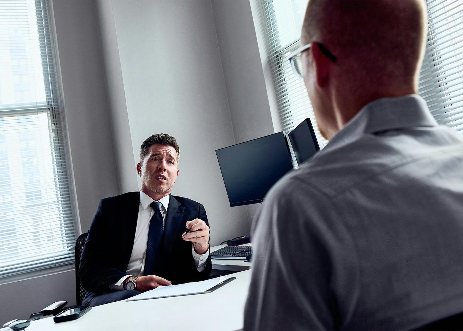 David E. Kwartler speaking to a client