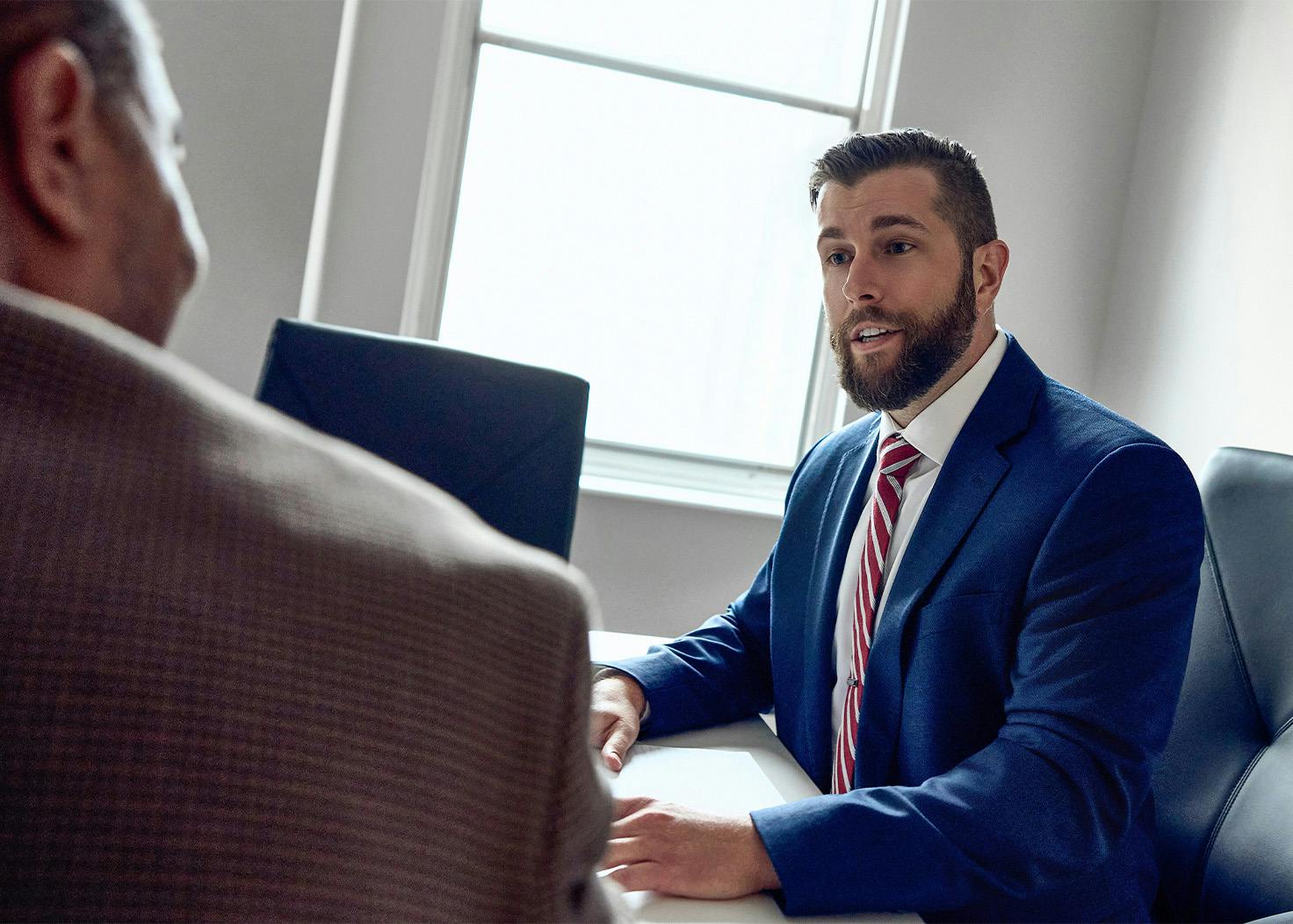 Joseph M. Hauschildt Jr. speaking to client