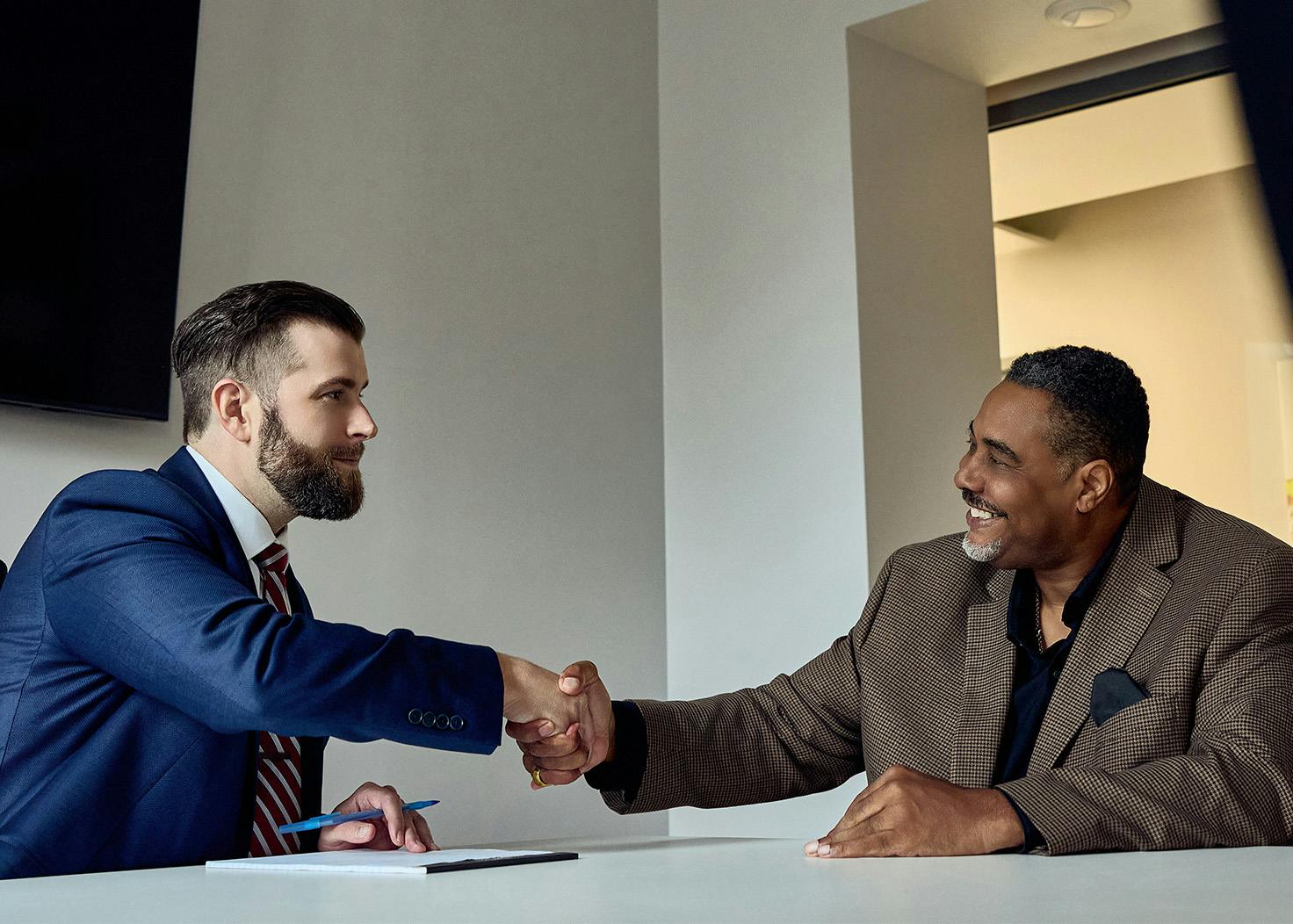 Joseph M. Hauschildt Jr. shaking client's hand