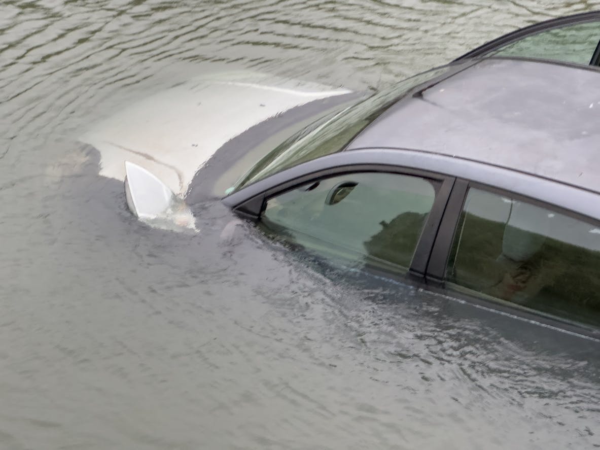 car in water following serious accident.