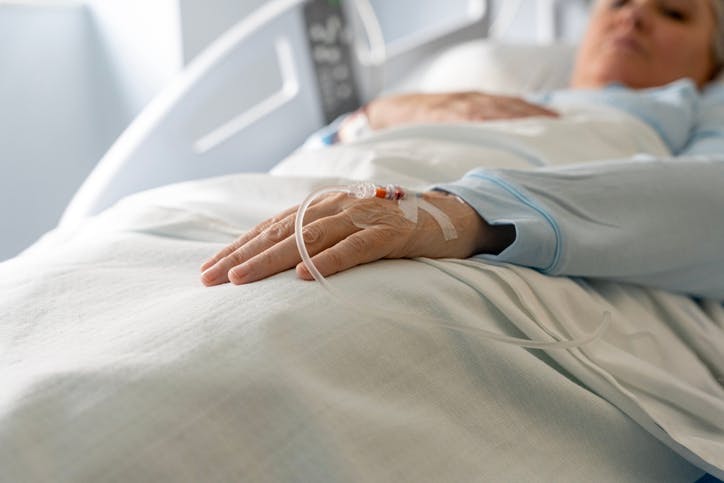 A woman in hospital bed
