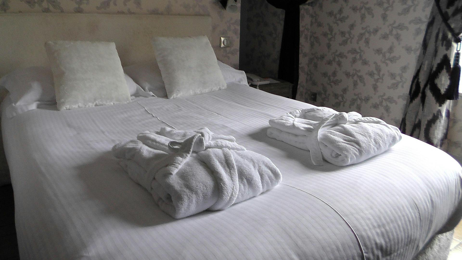 airbnb bed with towels