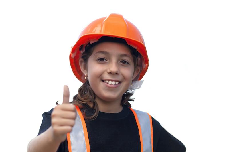A child in costume giving thumbs up