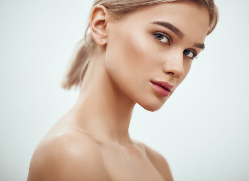 womans face turned to the side from the bust up