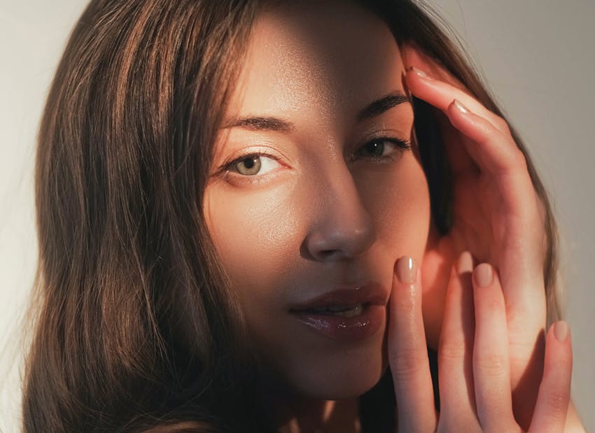woman with hands on face