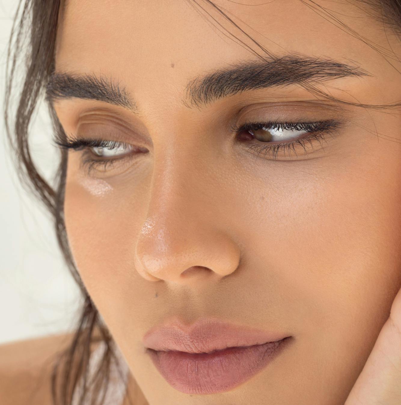 close up of womans face looking to the side