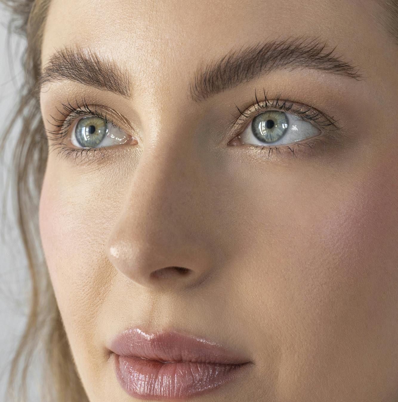 close up of womans face looking up