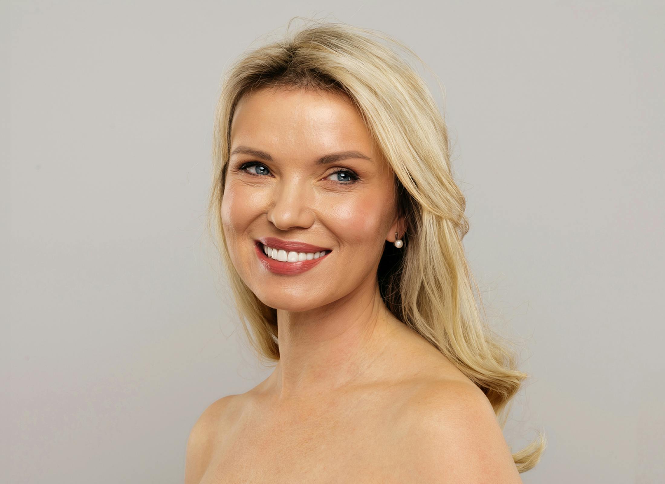 woman with hand on head