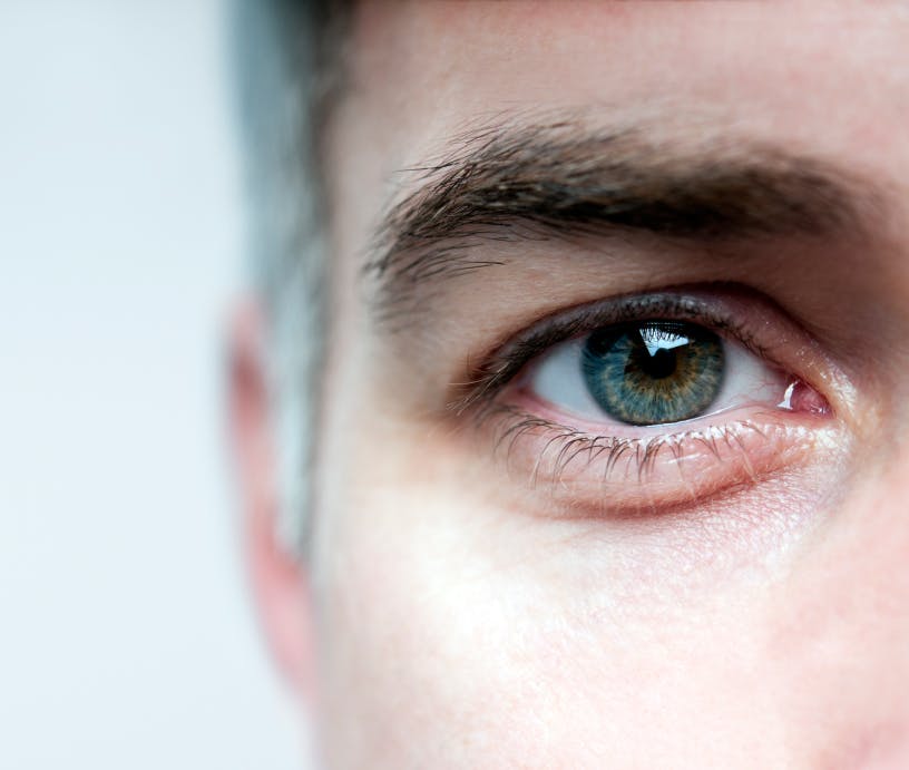close up image of man's eye