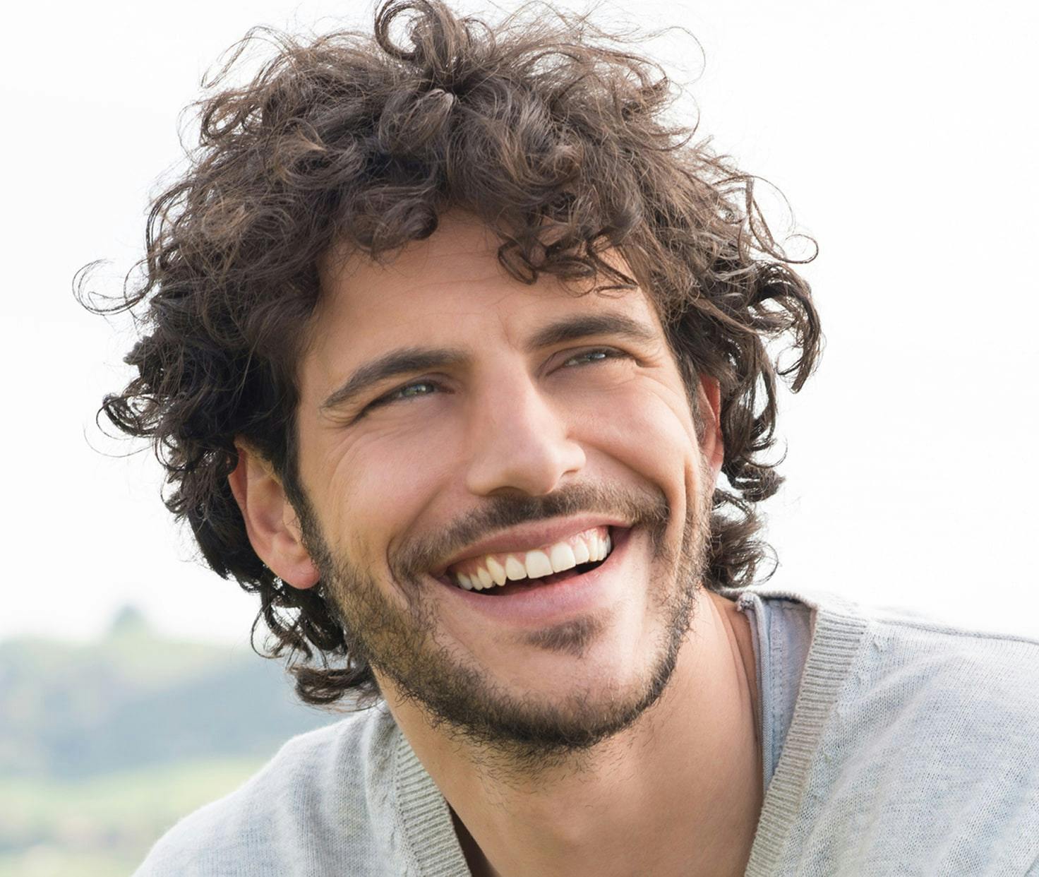 Happy guy smiling outdoors