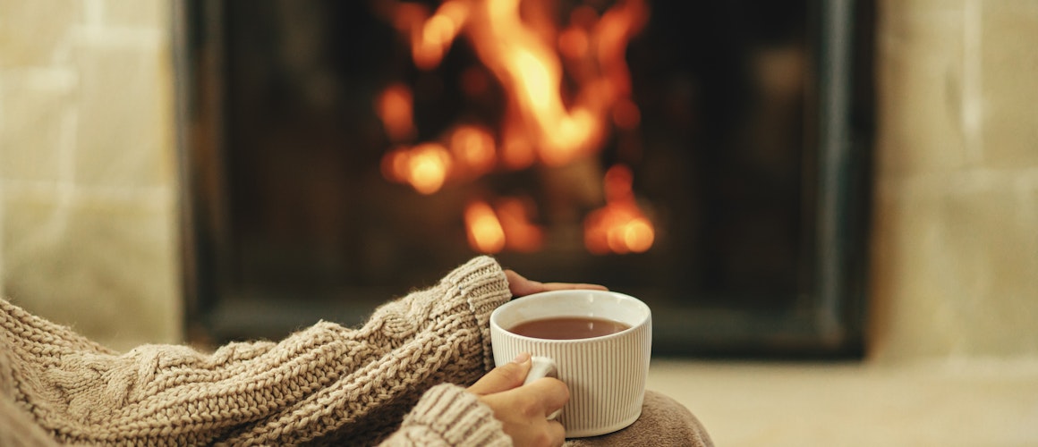 hot drink by fireplace